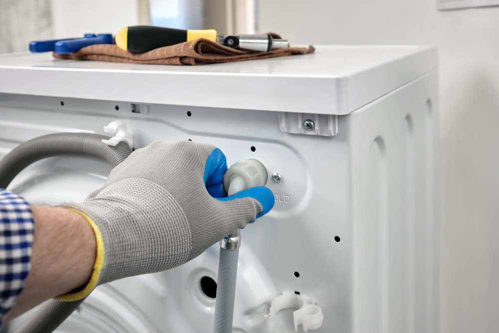 Plumber,In,Gloves,Repairing,Washer,On,Back,Side,Water,Supply